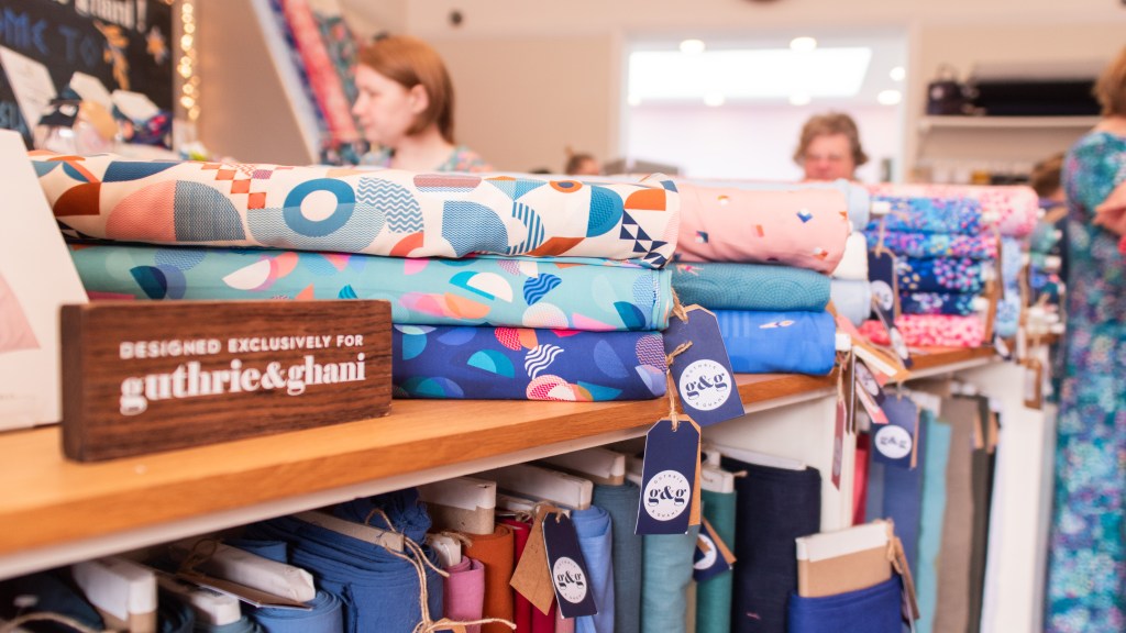 Shelf shot at Gurthie & Ghani showcasing colourful fabrics for sale
