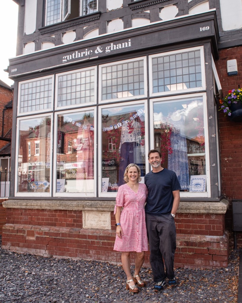 Lauren and her husband in front of her fabric store, Guthrie & Ghani