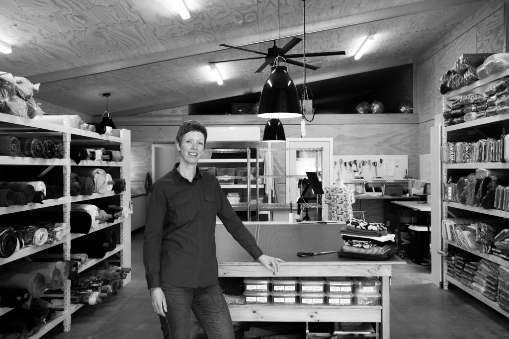 Maaike from MaaiDesigns among her fabric shelves